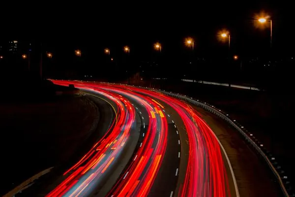 Long exposure of highway light trails at night across the city